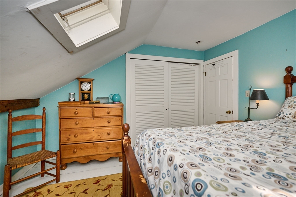 81 Smith Road Ashfield, MA 01330 - Photo 32 of 41 a bedroom with a bed and a dresser in it