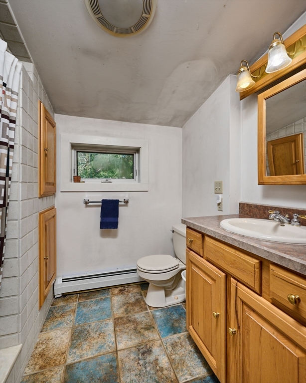 81 Smith Road Ashfield, MA 01330 - Photo 35 of 41 a bathroom with a granite countertop sink toilet and mirror