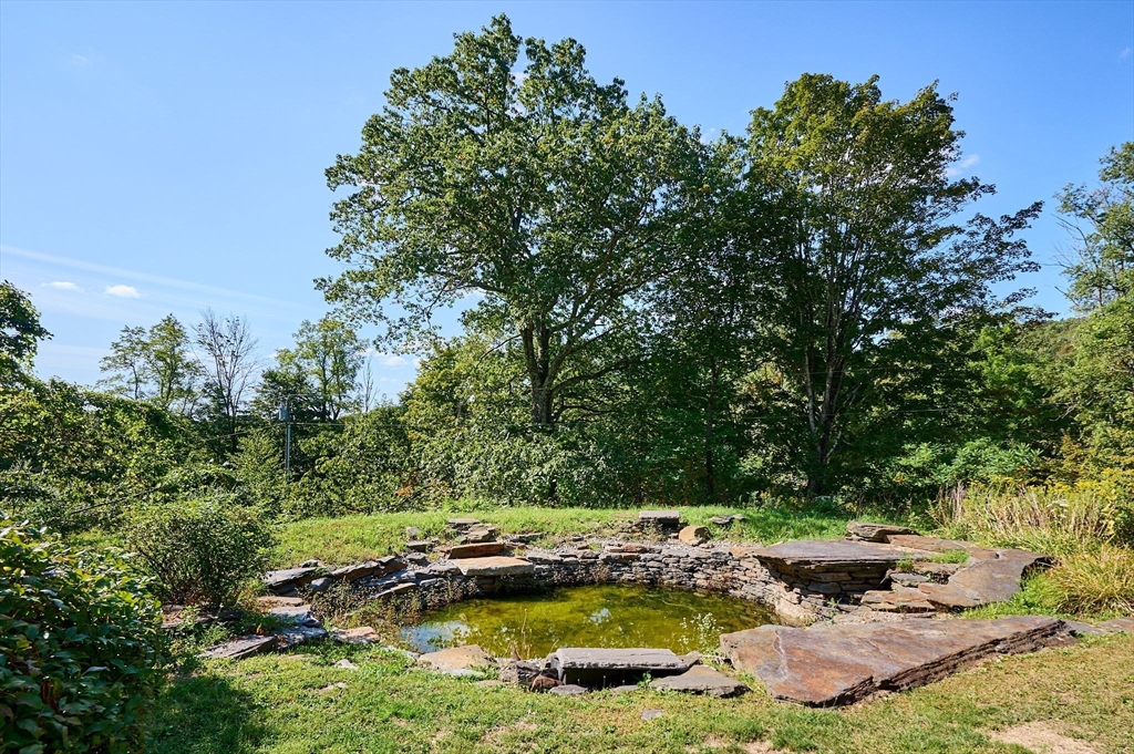 81 Smith Road Ashfield, MA 01330 - Photo 37 of 41 a view of a lake with sitting area