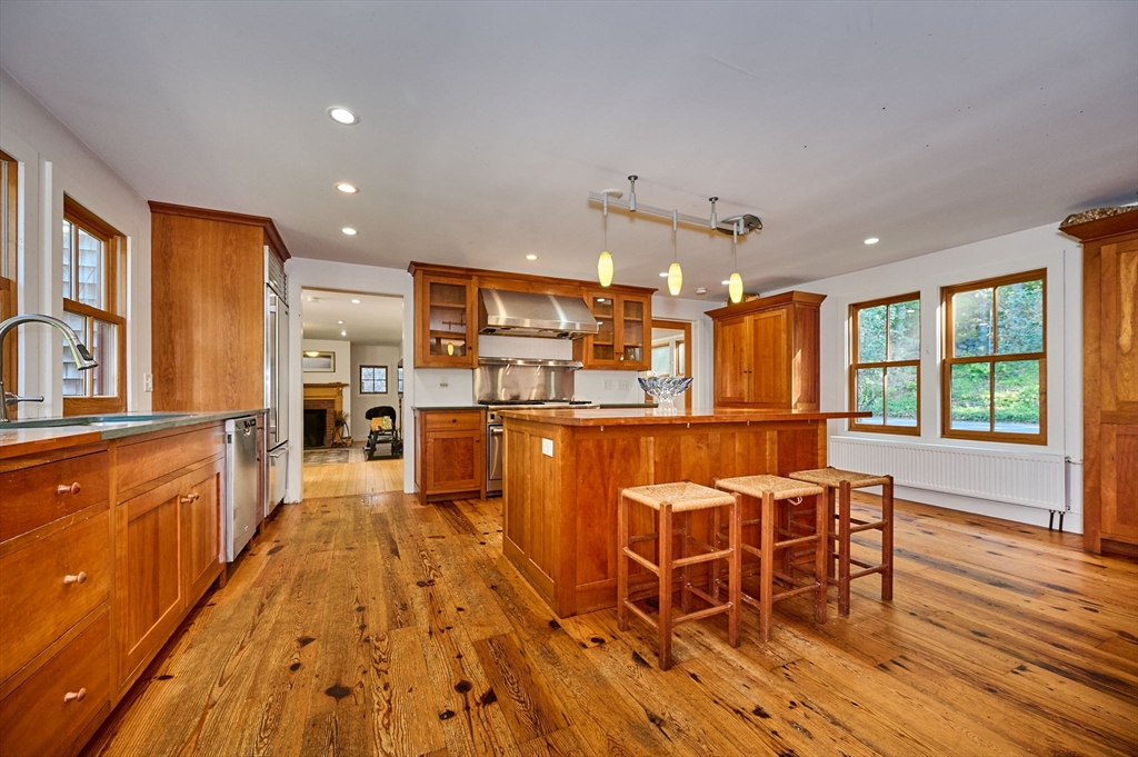 81 Smith Road Ashfield, MA 01330 - Photo 5 of 41 a large kitchen with a table and chairs