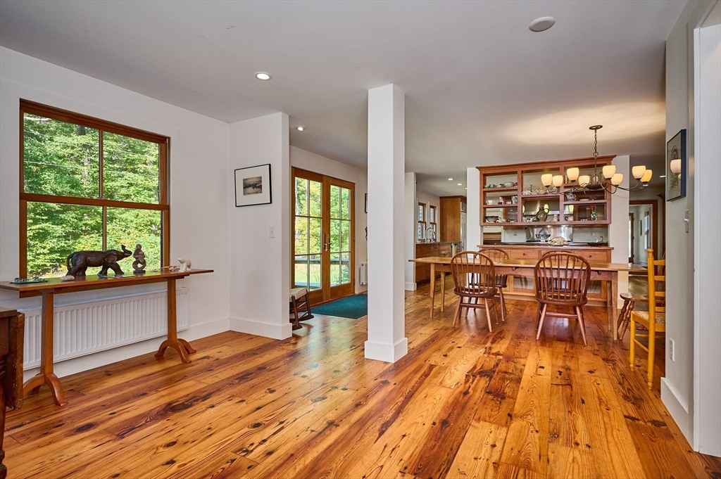 81 Smith Road Ashfield, MA 01330 - Photo 9 of 41 a view of a dining room with furniture and wooden floor
