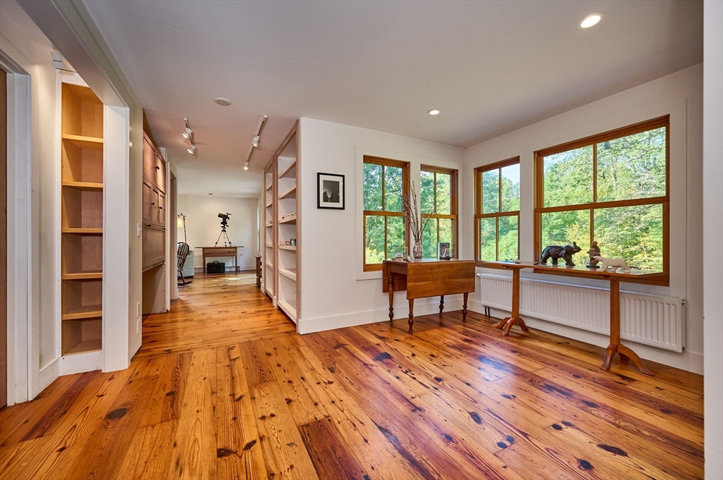 81 Smith Road Ashfield, MA 01330 - Photo 10 of 41 a spacious bedroom with a large window and a table