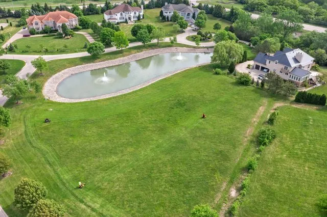 a view of a lake with houses in the back