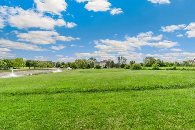 a view of a lake with a big yard