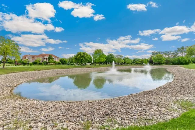 a view of a lake with a big yard