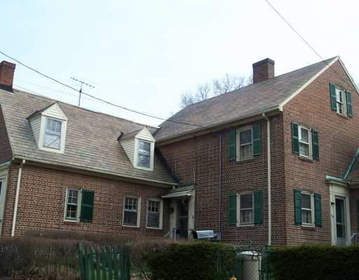 150 Alsace Street, Unit 150 Bridgeport, CT 06604 - Photo 1 of 1 a front view of a house with a yard