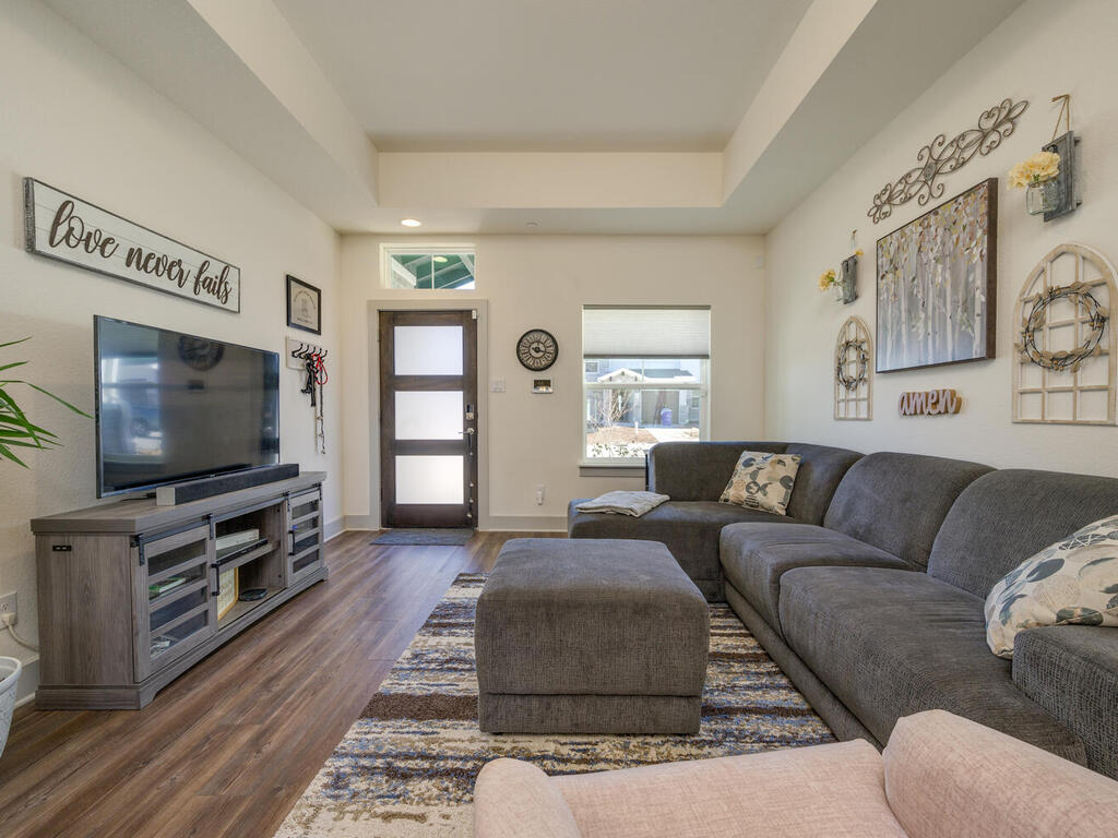 2257 Local Rebel Loop Leander, TX 78641 - Photo 7 of 26 a living room with furniture and a flat screen tv