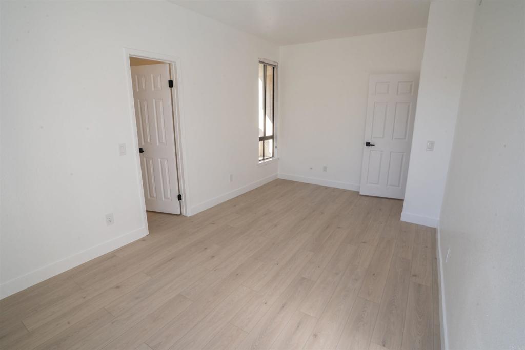 5845 Friars Road, Unit 1316 San Diego, CA 92110 - Photo 24 of 29 an empty room with windows