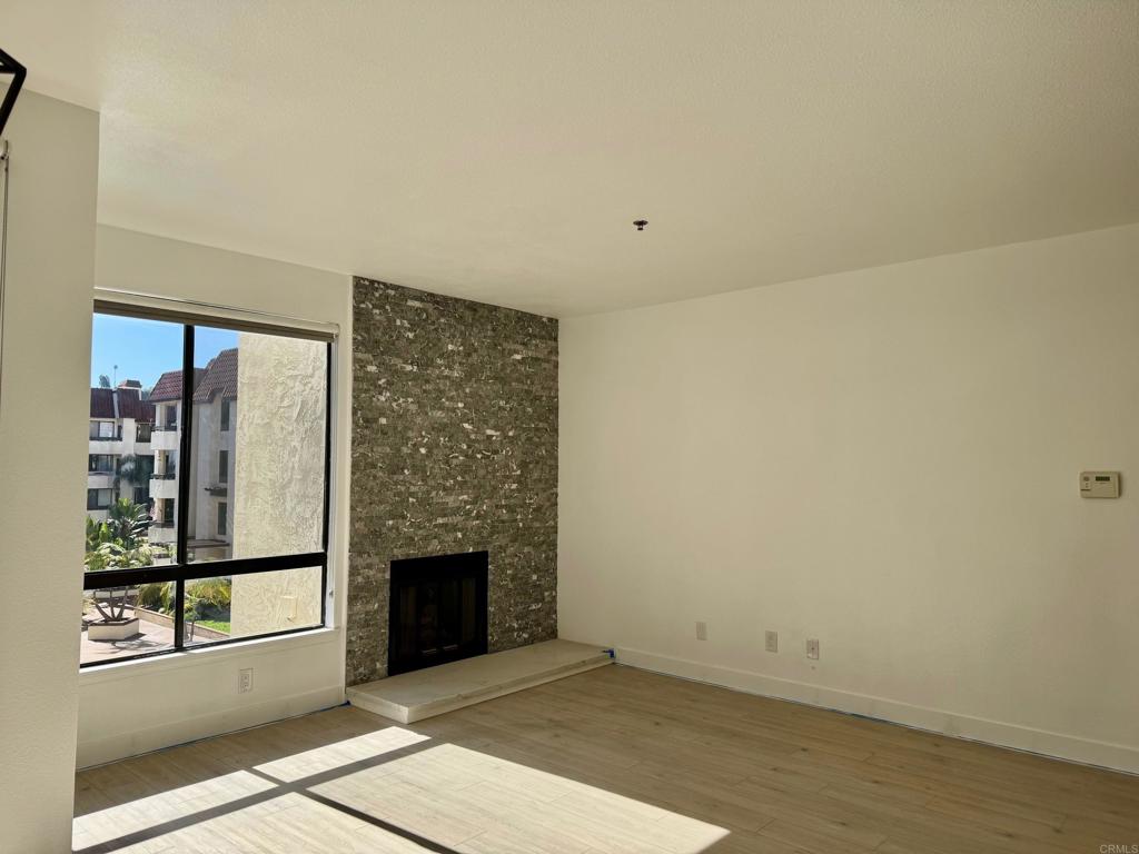 5845 Friars Road, Unit 1316 San Diego, CA 92110 - Photo 27 of 29 an empty room with windows