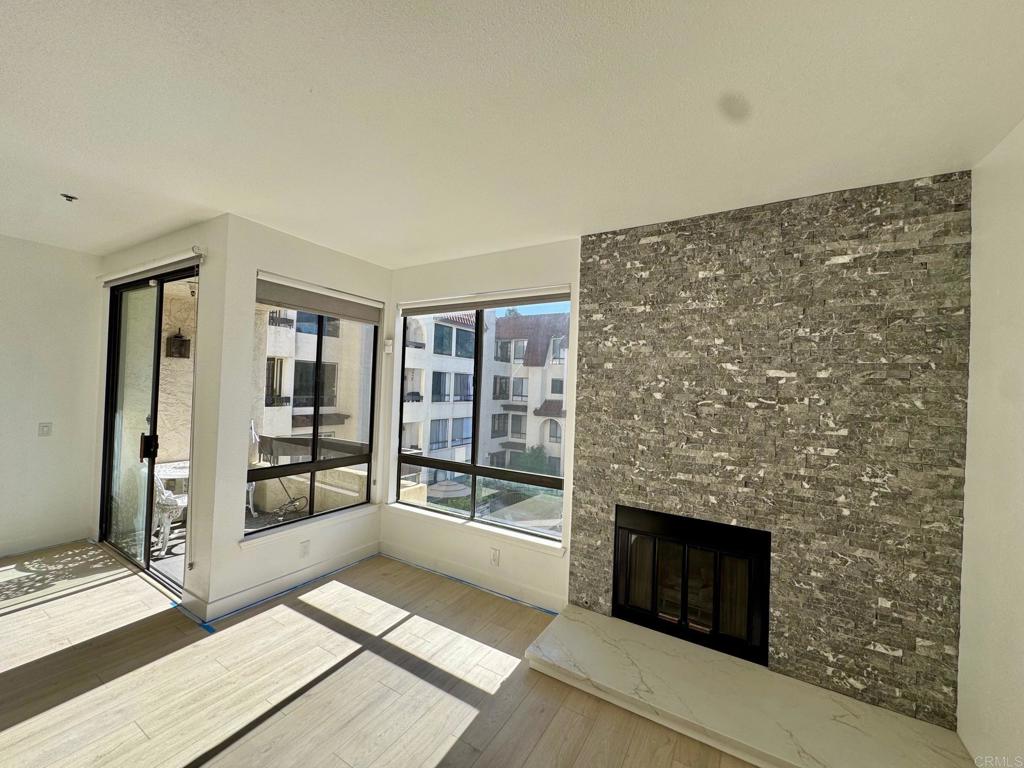 5845 Friars Road, Unit 1316 San Diego, CA 92110 - Photo 28 of 29 a living room with a fireplace