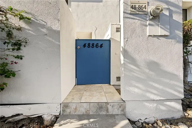 a door of a house with a yard
