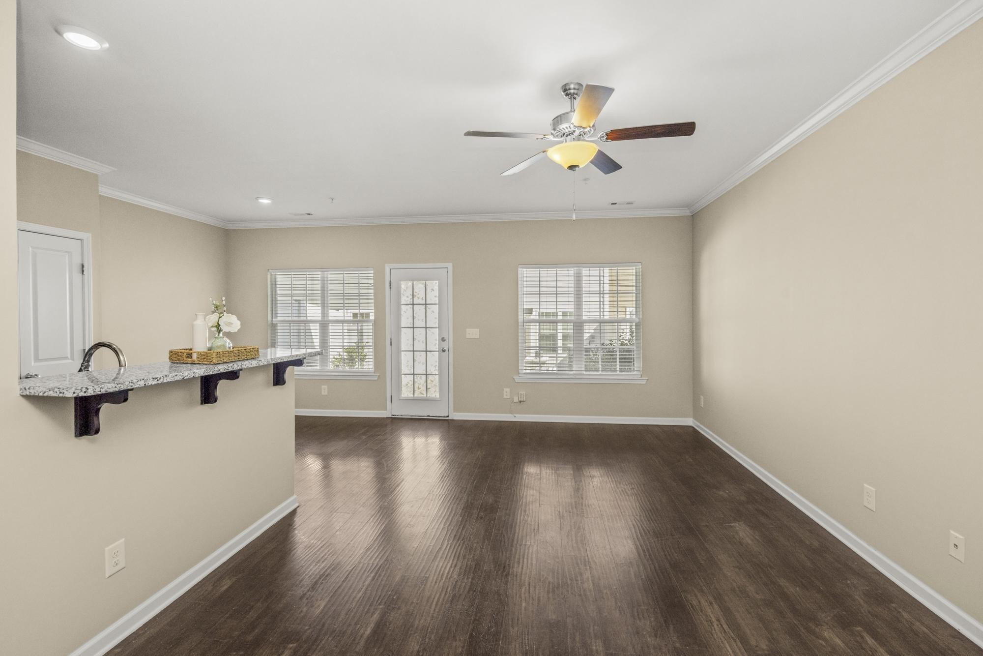 112 Bergen Drive Spring Hill, TN 37174 - Photo 11 of 37 a view of an empty room with a window and wooden floor