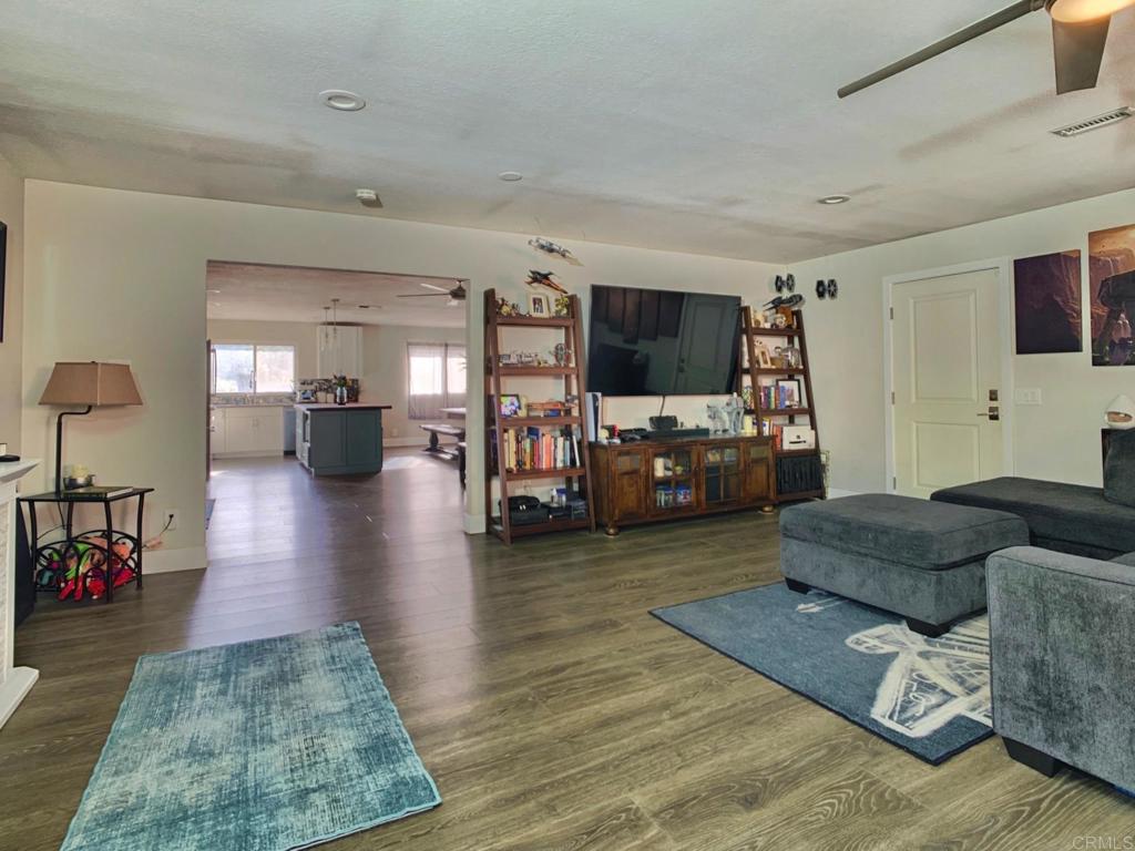 13758 Pomerado Road Poway, CA 92064 - Photo 17 of 32 a living room with furniture and a flat screen tv