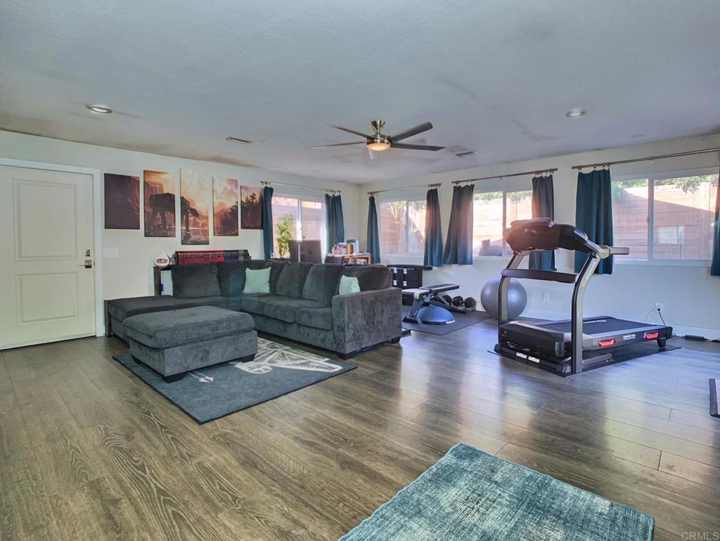 13758 Pomerado Road Poway, CA 92064 - Photo 18 of 32 a living room with furniture and wooden floor