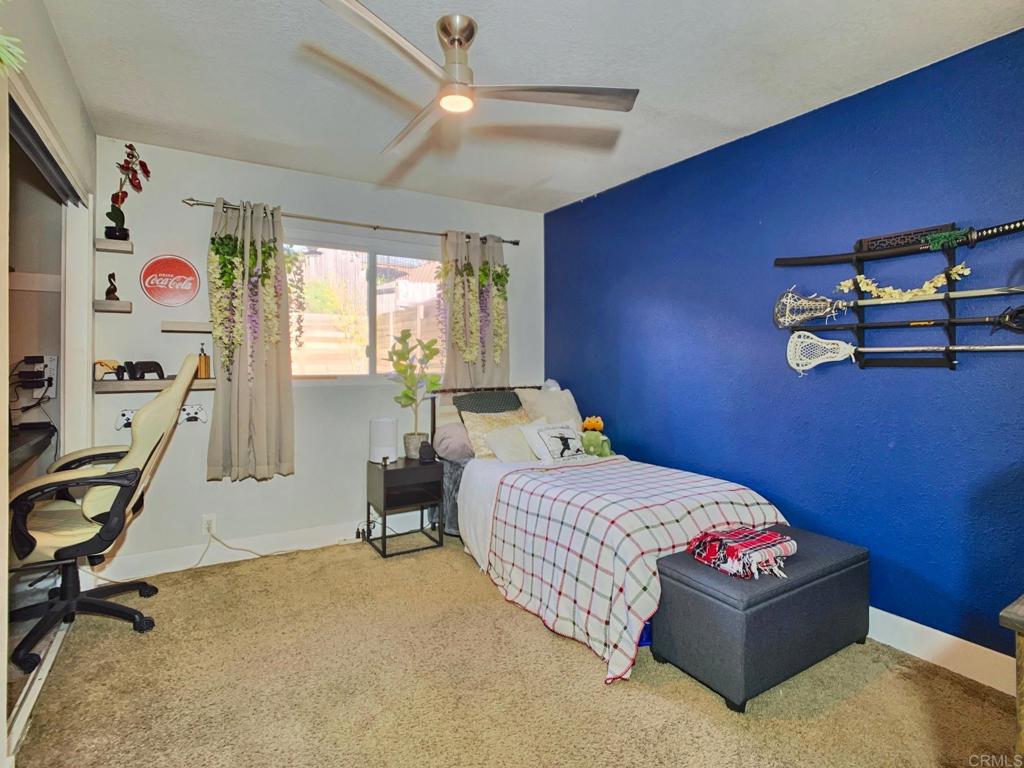 13758 Pomerado Road Poway, CA 92064 - Photo 25 of 32 a bedroom with bed and a window