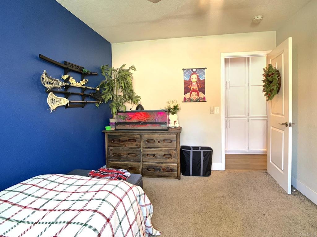 13758 Pomerado Road Poway, CA 92064 - Photo 26 of 32 a bedroom with a bed and a dresser