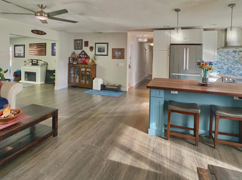 13758 Pomerado Road Poway, CA 92064 - Photo 7 of 32 a living room with furniture and a fireplace