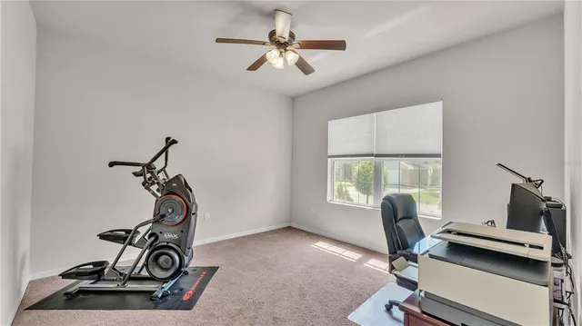 a dining room with wooden floor a chandelier a wooden table and chairs