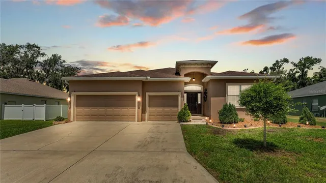 a view of a dining room and chandelier fan wooden floor and a chandelier