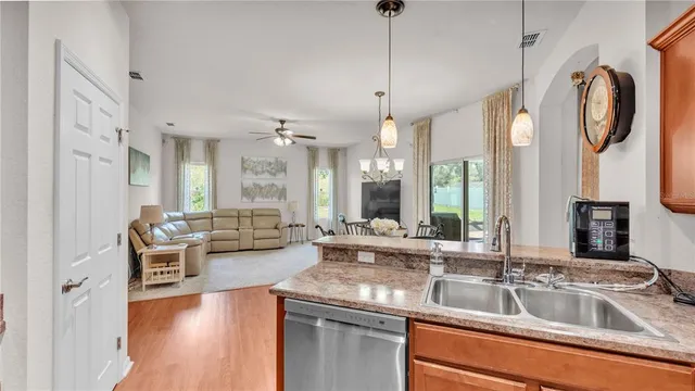 a bathroom with a granite countertop sink mirror and bathtub