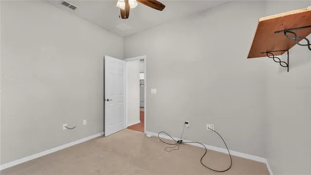 an empty room with fan