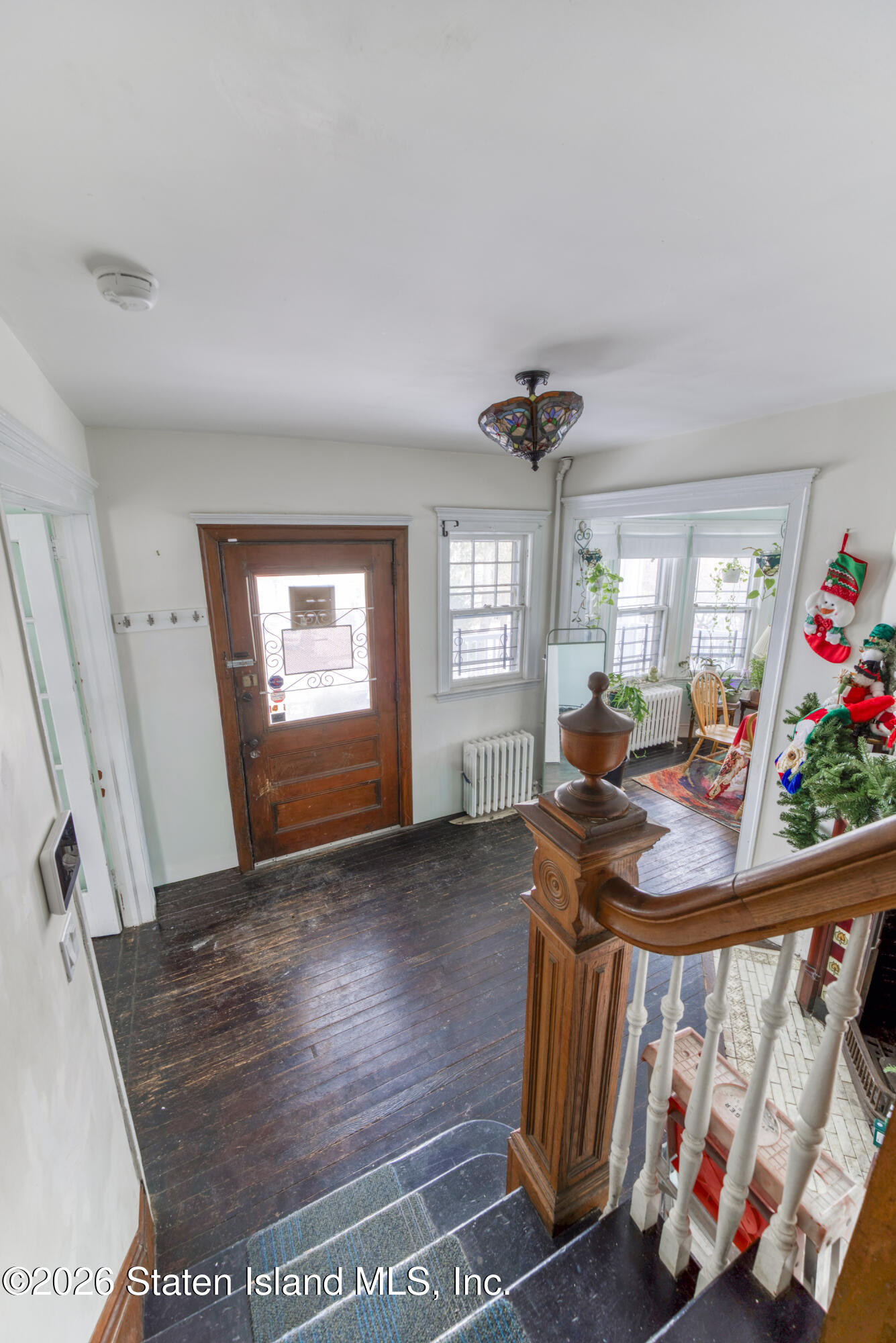 226 Castleton Avenue Staten Island, NY 10301 - Photo 13 of 32 a view of a livingroom with furniture hardwood floor and windows