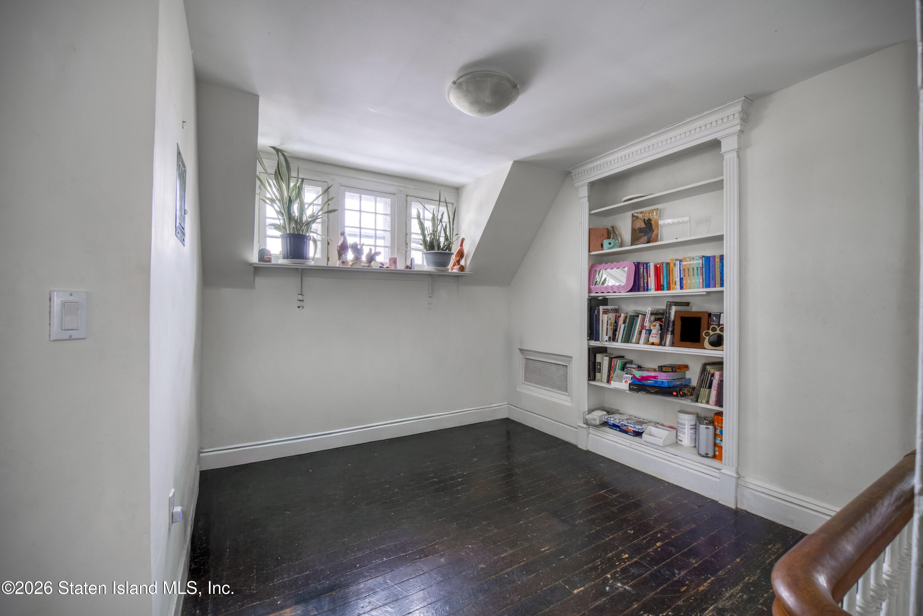 226 Castleton Avenue Staten Island, NY 10301 - Photo 15 of 32 a view of room with window and wooden floor