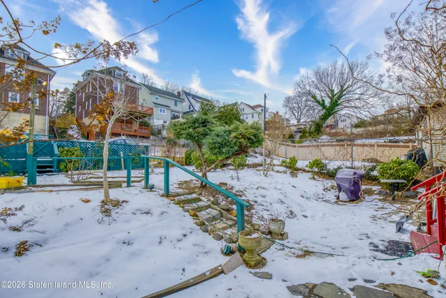 a view of a backyard with a sitting area