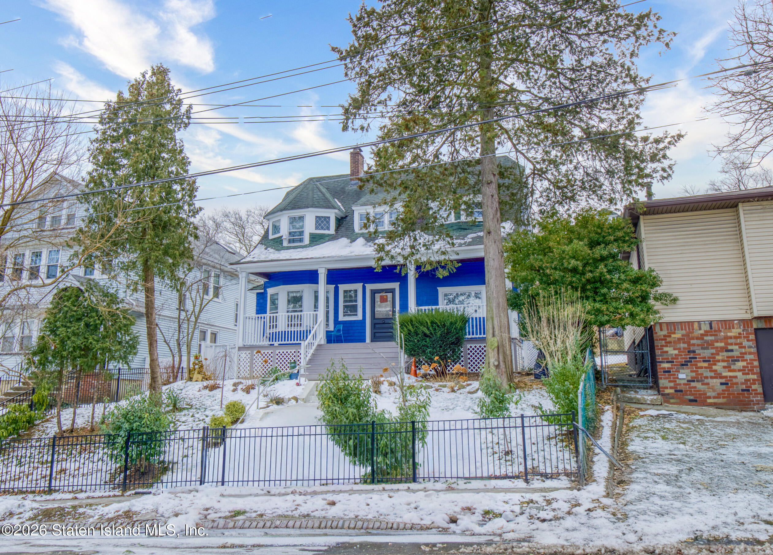 226 Castleton Avenue Staten Island, NY 10301 - Photo 3 of 32 a front view of a house with garden