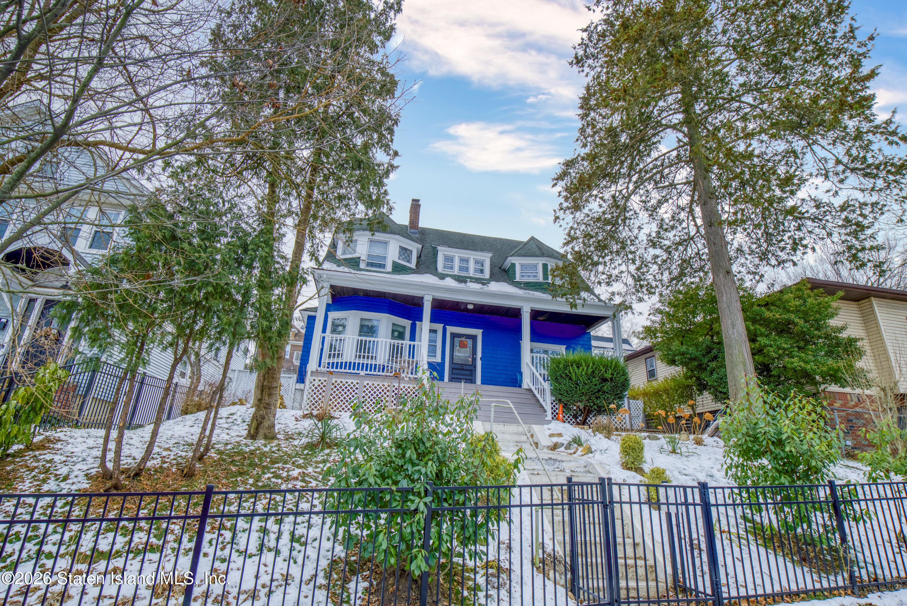 226 Castleton Avenue Staten Island, NY 10301 - Photo 32 of 32 a view of a house with a yard and potted plants