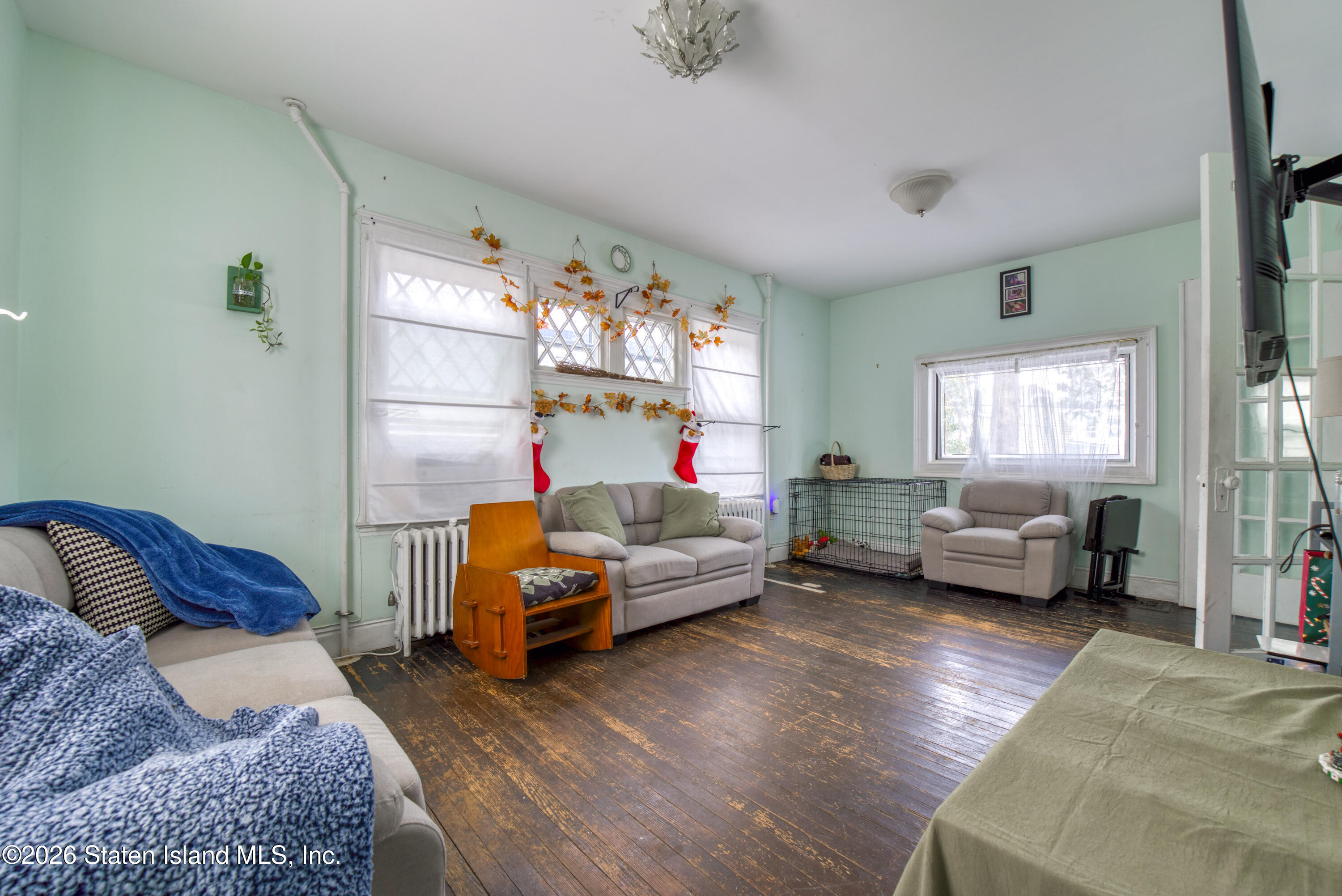 226 Castleton Avenue Staten Island, NY 10301 - Photo 8 of 32 a bedroom with furniture and a couch