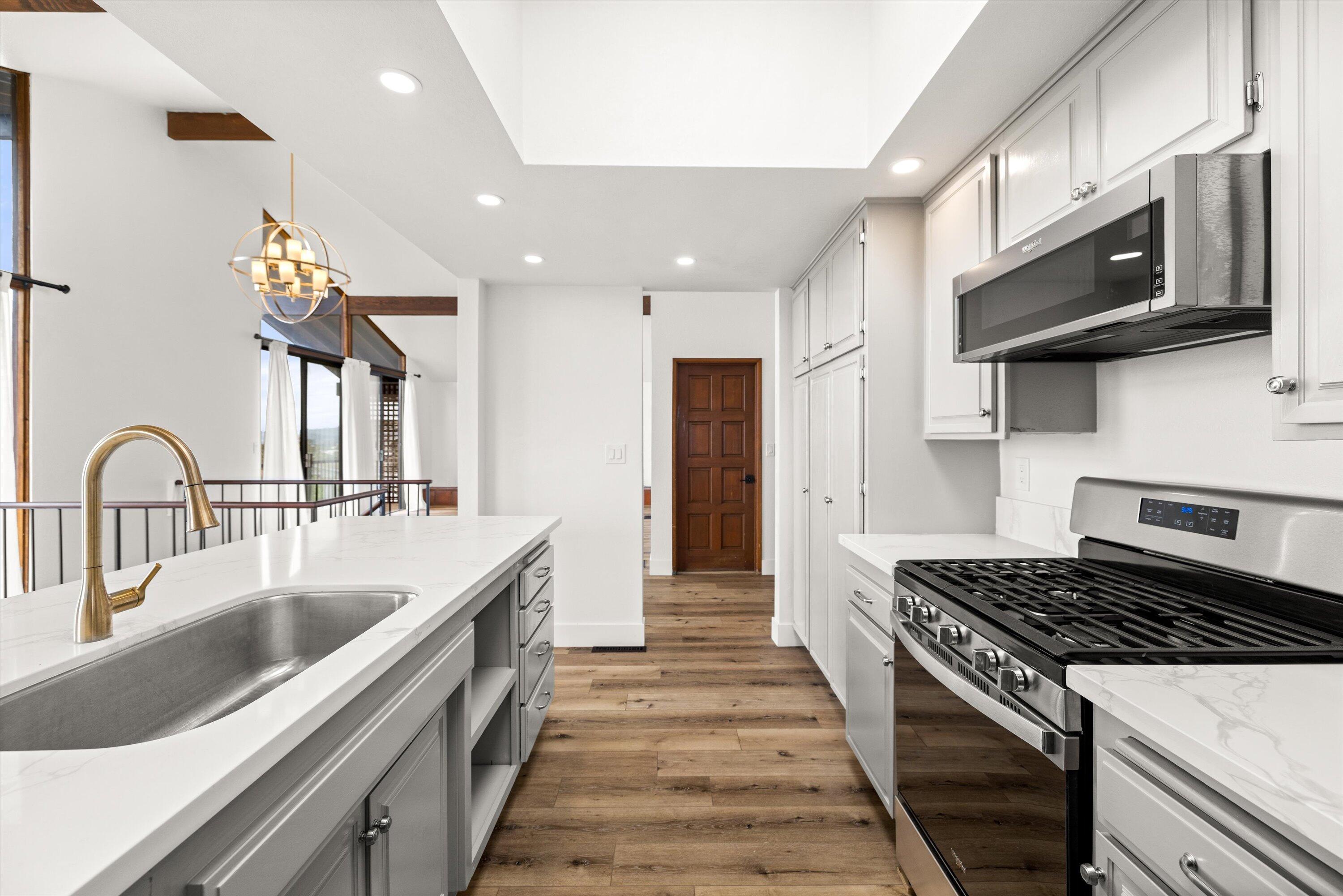 34 Rubio Road Santa Barbara, CA 93103 - Photo 12 of 36 a kitchen with stainless steel appliances granite countertop a stove and a sink