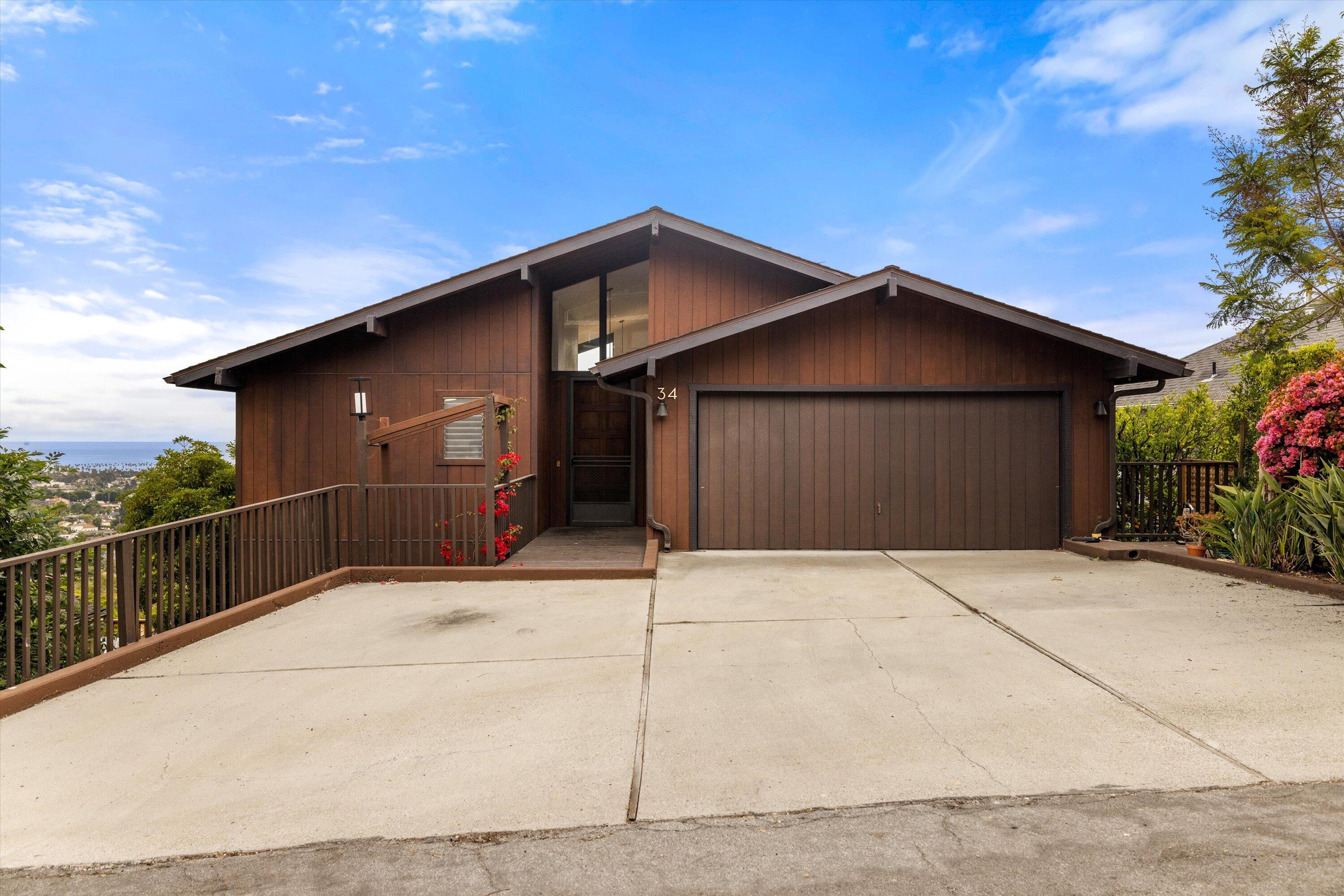 34 Rubio Road Santa Barbara, CA 93103 - Photo 4 of 36 a front view of a house with a garage