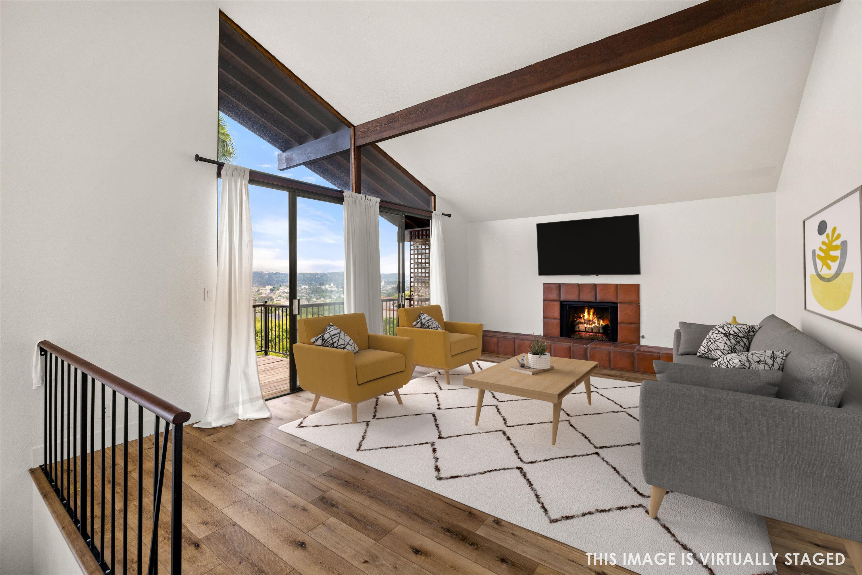 34 Rubio Road Santa Barbara, CA 93103 - Photo 8 of 36 a living room with furniture a flat screen tv and a floor to ceiling window