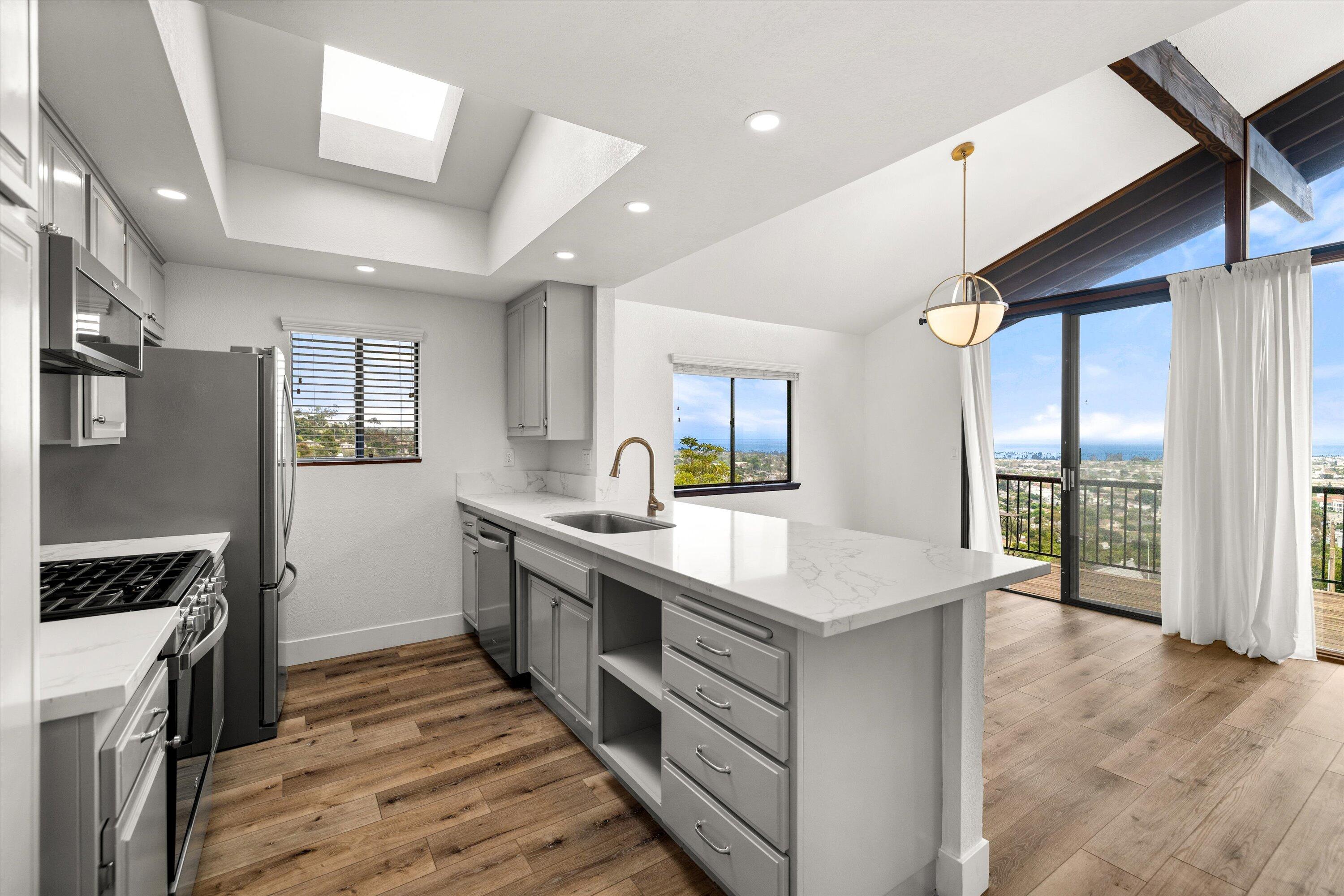 34 Rubio Road Santa Barbara, CA 93103 - Photo 10 of 36 a kitchen with a stove and a refrigerator