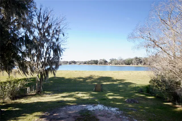 a view of a lake from a yard