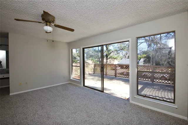 a view of empty room with floor to ceiling window