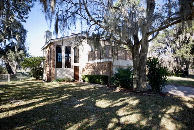 a pathway of a house with a yard