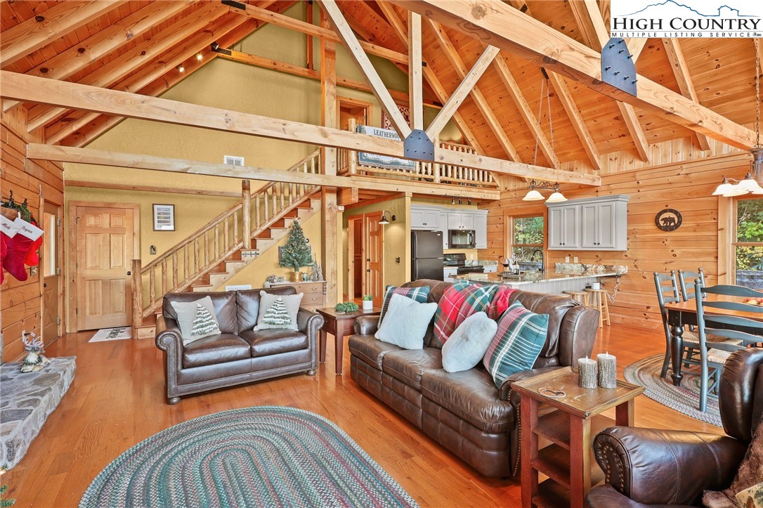 305 Fox Cove Road Ferguson, NC 28624 - Photo 13 of 50 a living room with furniture and a rug