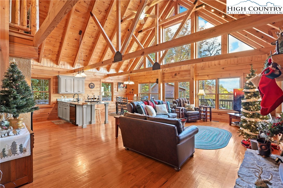 305 Fox Cove Road Ferguson, NC 28624 - Photo 14 of 50 a living room with fireplace furniture and a large window