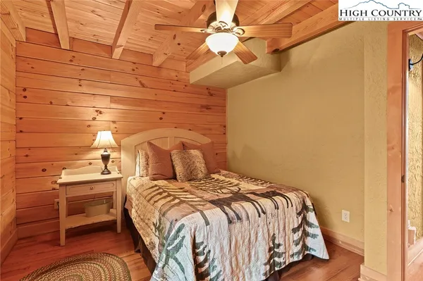 a bedroom with furniture and a bed