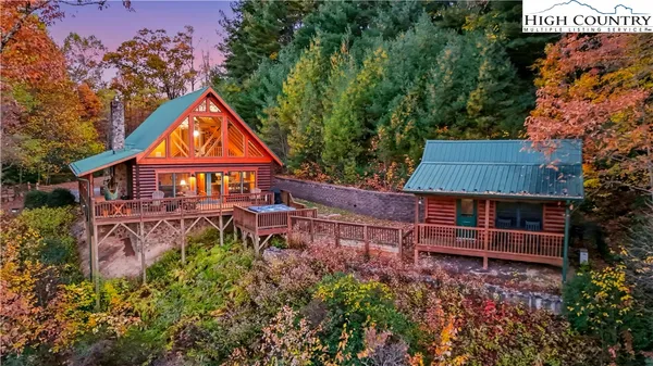a view of a kitchen with kitchen island granite countertop a large window a sink and counter space
