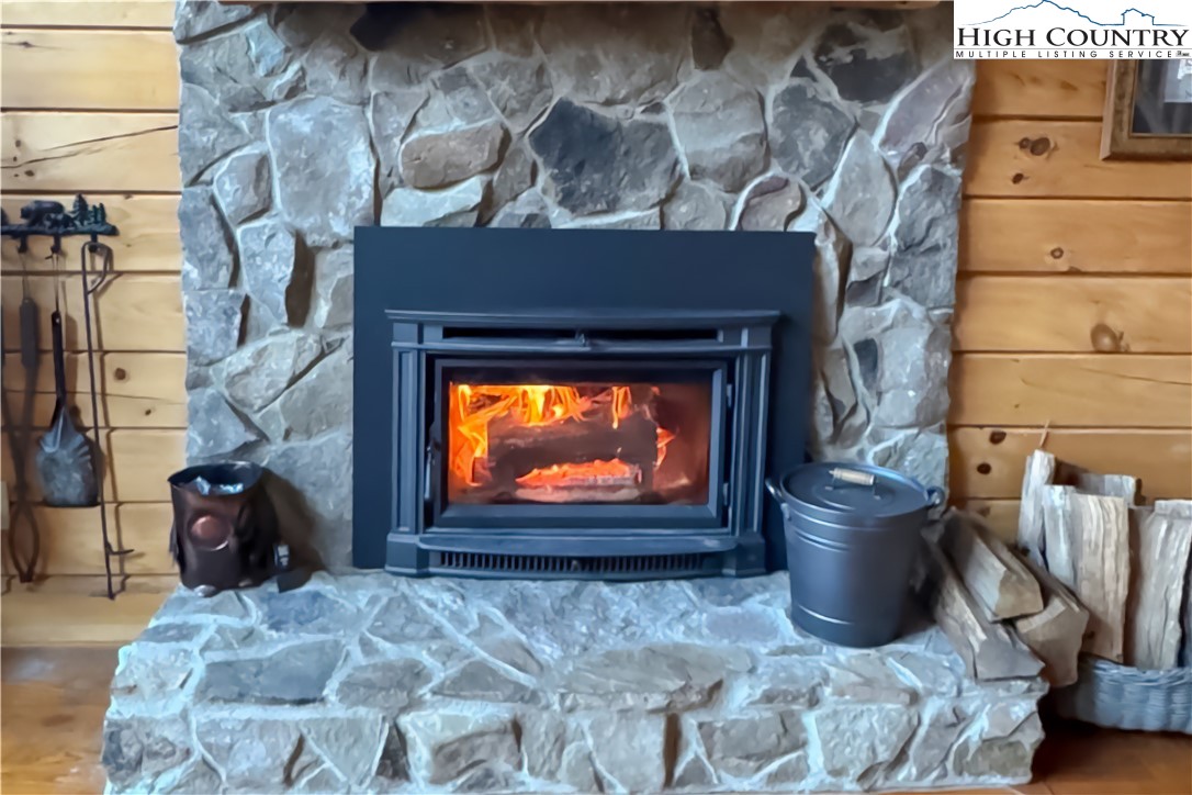 305 Fox Cove Road Ferguson, NC 28624 - Photo 41 of 50 a view of a fireplace with furniture and a fireplace