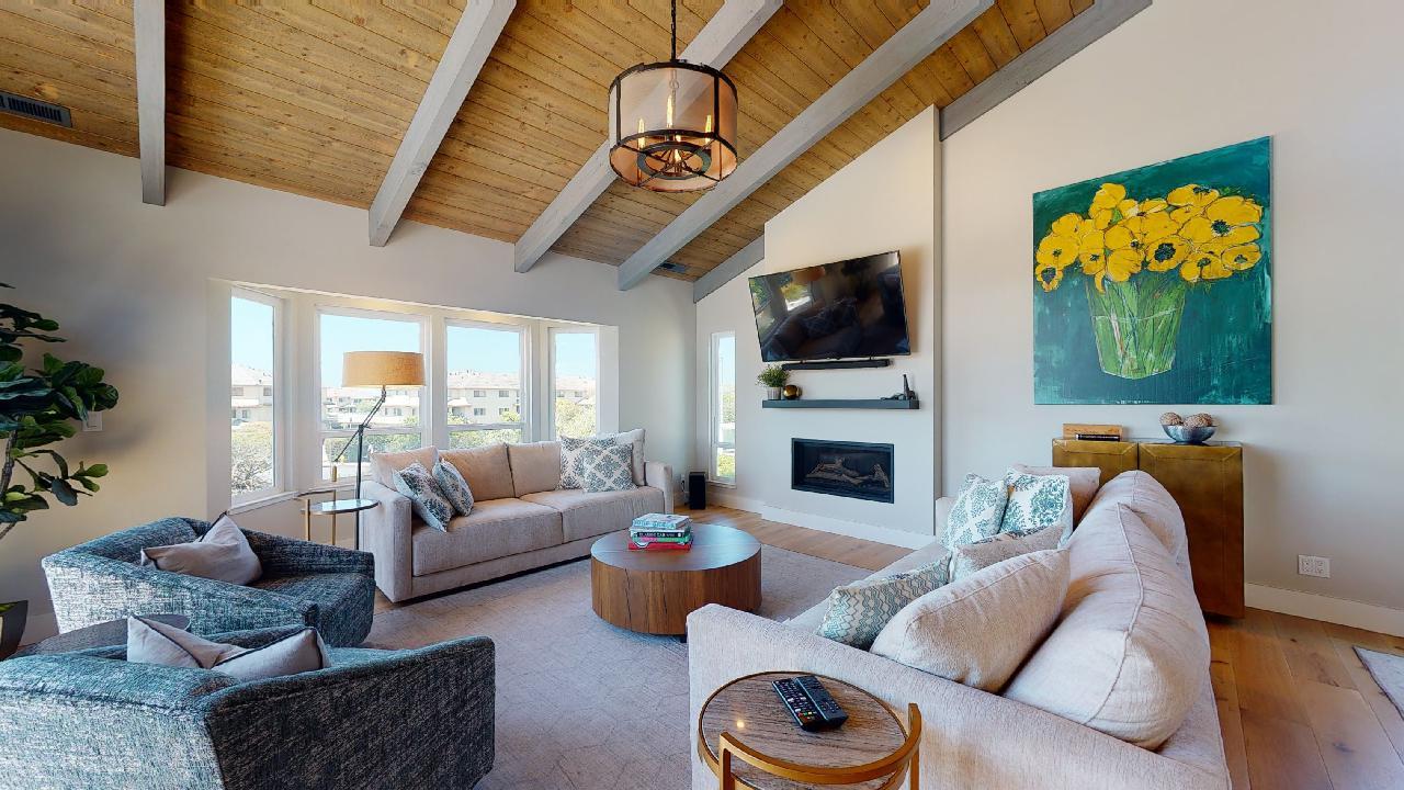 150 Vía Soderini Aptos, CA 95003 - Photo 12 of 73 a living room with furniture a flat screen tv and a fireplace