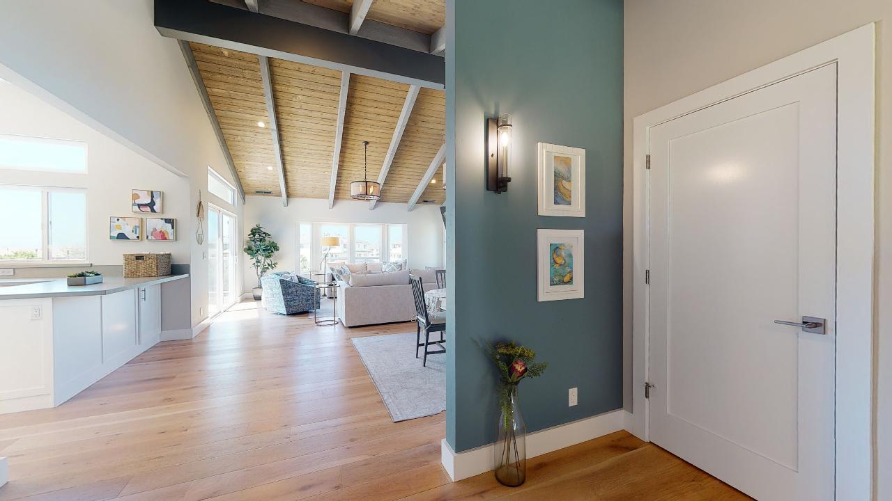 150 Vía Soderini Aptos, CA 95003 - Photo 15 of 73 a view of a hallway with wooden floor and a living room