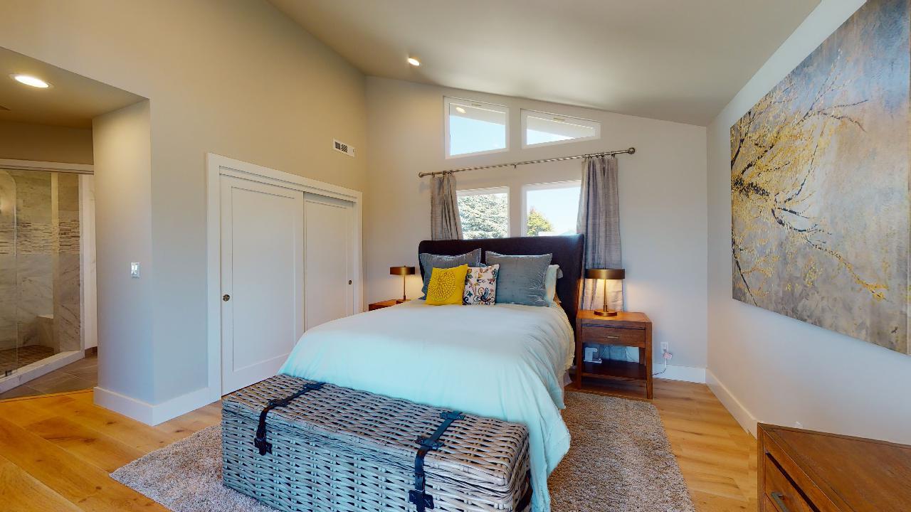 150 Vía Soderini Aptos, CA 95003 - Photo 25 of 73 a bedroom with a bed and wooden floor