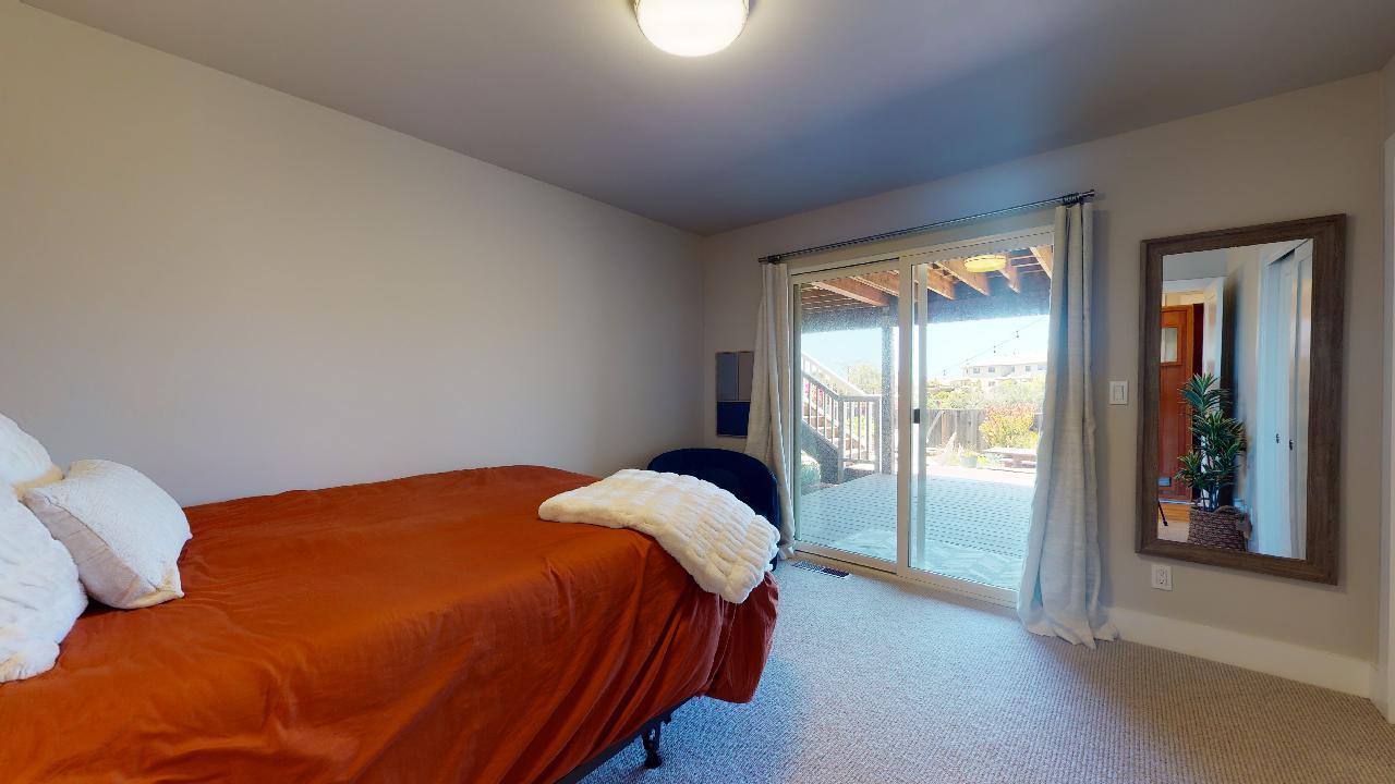 150 Vía Soderini Aptos, CA 95003 - Photo 30 of 73 a bedroom with a bed and a large window