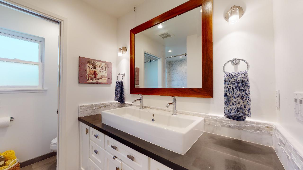 150 Vía Soderini Aptos, CA 95003 - Photo 36 of 73 a bathroom with a sink and a mirror