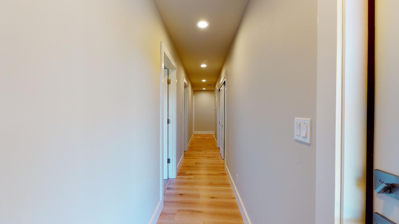 150 Vía Soderini Aptos, CA 95003 - Photo 41 of 73 a view of a hallway with wooden floor