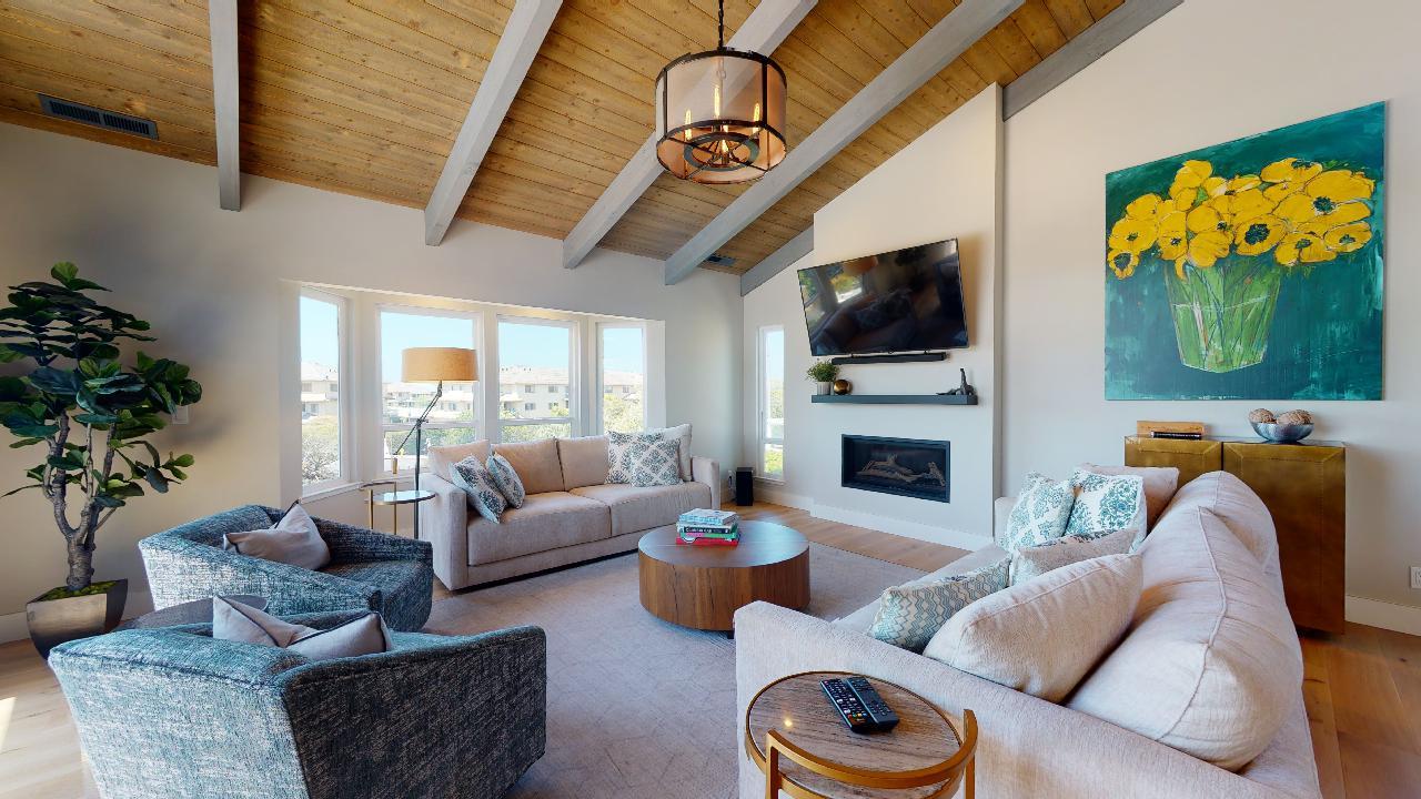 150 Vía Soderini Aptos, CA 95003 - Photo 9 of 73 a living room with furniture a flat screen tv and a fireplace